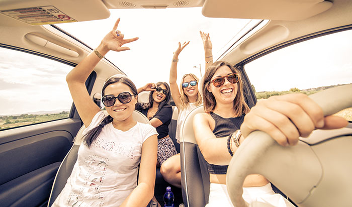 People happily driving home after their car was fixed